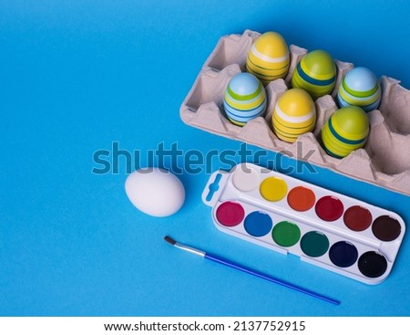 Easter DIY. Easter preparation. multi-colored paints and a brush for decorating eggs. creativity with children for decoration for Easter. Royalty-Free Stock Photo #2137752915