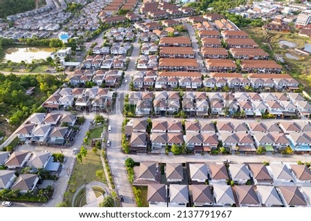 New development real estate. Aerial view of residential houses and driveways neighborhood during a fall sunset or sunrise time.Tightly packed homes.Top down view over private houses in phuket thailand