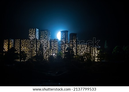Cartoon style city buildings. Realistic city building miniatures with lights. background. Decorative city. Selective focus
