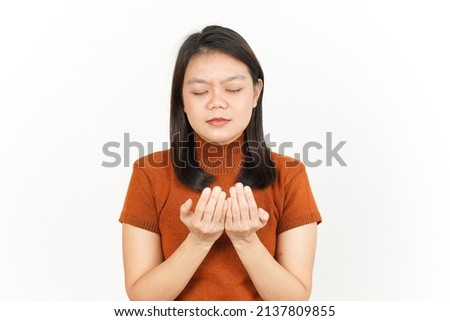 Praying Gesture Of Beautiful Asian Woman Isolated On White Background