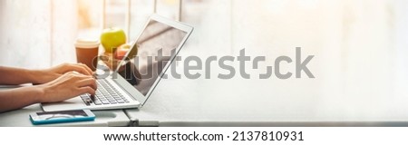 Banner Blogger Woman hands typing laptop keyboard. Panorama women hand using laptop social network person. Freelance girl work from home internet call conference sitting at home office with copyspace Royalty-Free Stock Photo #2137810931