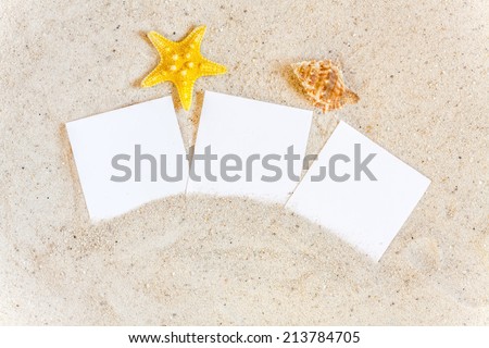 Three blank instant pictures with Seashells and Starfish in the Sand