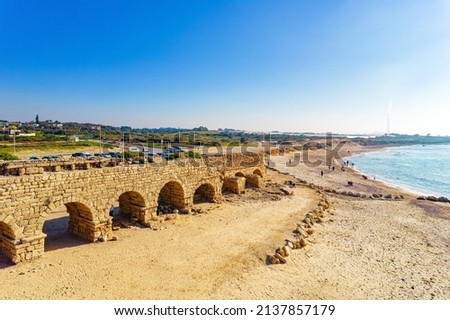The aqueduct built during the reign of Herod the Great. January sunny and clear day. Aerial view photos. Israel. Mediterranean sea beach. Caesarea. Royalty-Free Stock Photo #2137857179