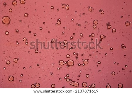 multicolor water background with bubbles. Bubbles Macro olive oil on pink background