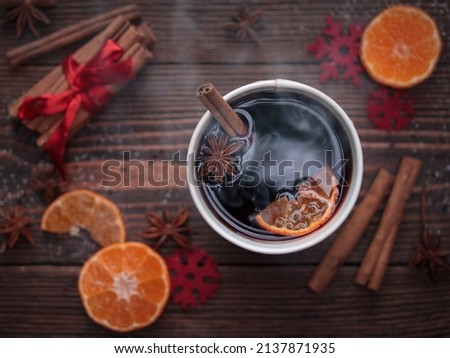 Hot tea with cinnamon and oranges  mulled wine