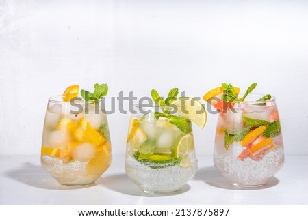 Summer healthy cocktails, mocktails. Set of various citrus lemonades mojito, with lime, lemon, orange, grapefruit, diet detox beverages  Royalty-Free Stock Photo #2137875897