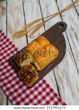 Bread is a staple food prepared from a dough of flour (usually wheat) and water, usually by baking. ROTI SOBEK Royalty-Free Stock Photo #2137901675
