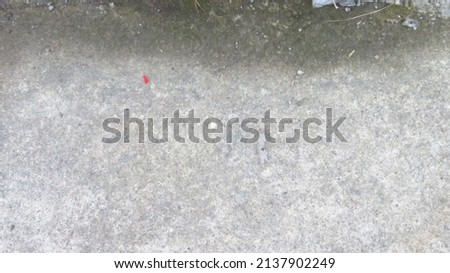 blurry and grainy low exposure photo of a rough gray cement and concrete texture pattern