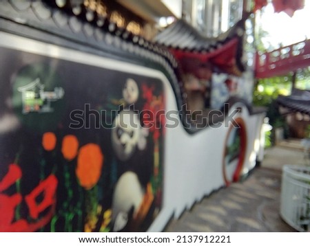 blurred of building with chinese or mandarin architectural style.  can be used as a background