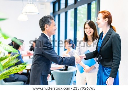 Businessman posted overseas in the office Royalty-Free Stock Photo #2137926765