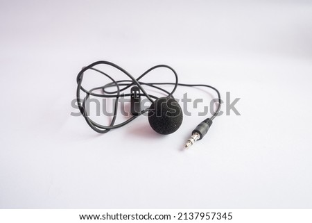 black clip on mic with 3.5mm jack TRS type, isolated on white background