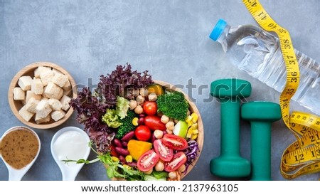 Diet and Healthy life loss weight exercise Concept. Fresh vegetable salad with Weight scale measure prevention for women diet slimming. Lifestyle Time and Healthy Royalty-Free Stock Photo #2137963105