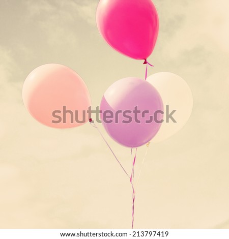 Colorful balloons over retro vintage background 