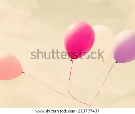 Colorful balloons over retro vintage background 