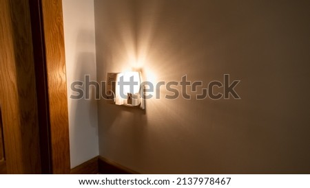 Night light plugged into a wall in a house Royalty-Free Stock Photo #2137978467