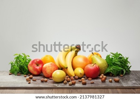 Mix of healthy fruits on the table. Photo of food on a dark background