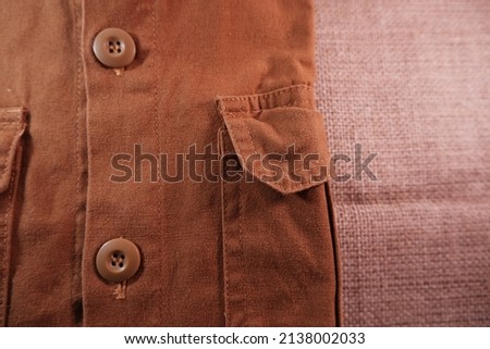 Canvas fabric is currently widely used as the basic material of jackets, office shirts, pants, hats, to bags. Due to strong canvas characters Royalty-Free Stock Photo #2138002033