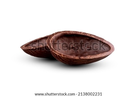 easter chocolate egg opened in two halves emptied close-up isolated in white background Royalty-Free Stock Photo #2138002231