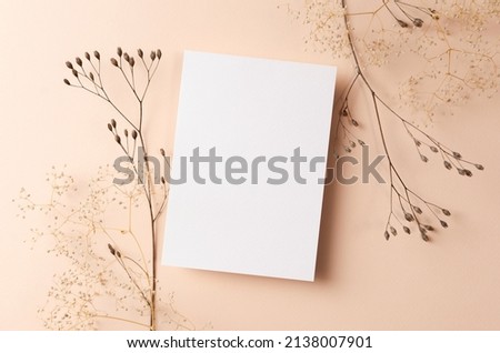 Wedding invitation or greeting card mockup with dry nature plants twigs