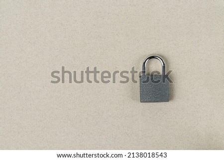 Padlock closed on a gray background close-up. Security concept