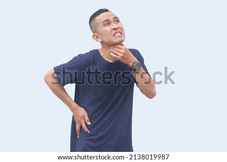 thirsty asian man touching his throat Royalty-Free Stock Photo #2138019987