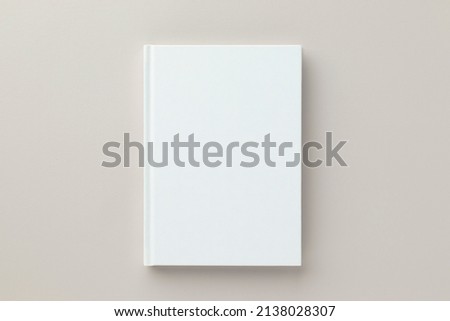 White book blank cover mockup on a beige background, flat lay, mockup Royalty-Free Stock Photo #2138028307