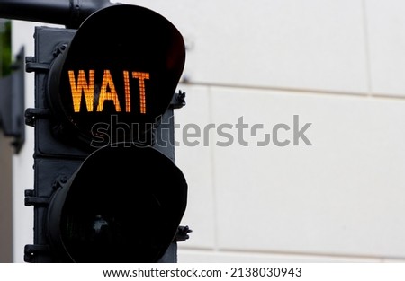 Traffic light telling pedestrians to wait