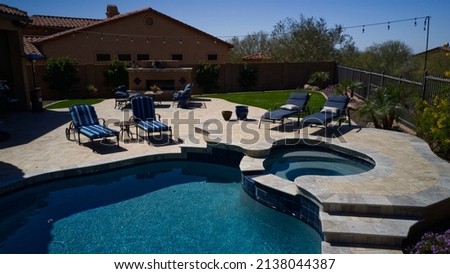 an Aerial view of a desert landscaped travertine pool deck in Arizona.