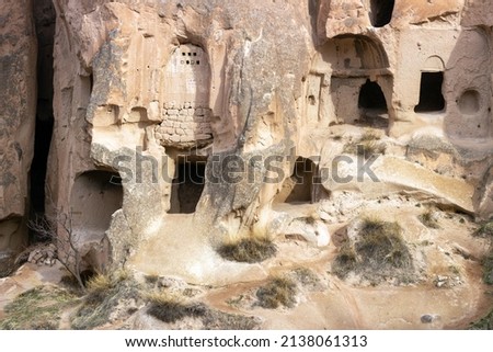 
View of the cave house in Zelve Open-Air Museum.  Amazing cave house. Spectacular pictures of Zelve historical air museum. Nevşehir - Turkey. Royalty-Free Stock Photo #2138061313