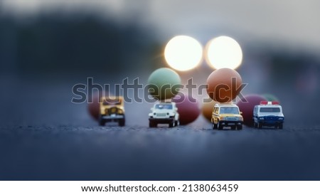 Soft focus of Easter eggs on toy cars.Easter concept background.
