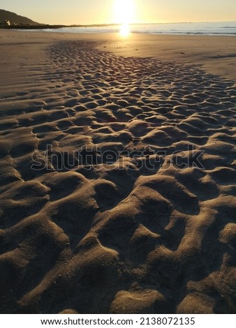 Markings in the sand, sunset in the northern part of Norway 