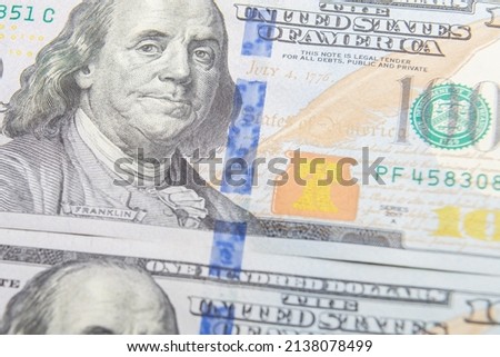 One hundred dollar bills slices on the table close-up. Horizontal photo