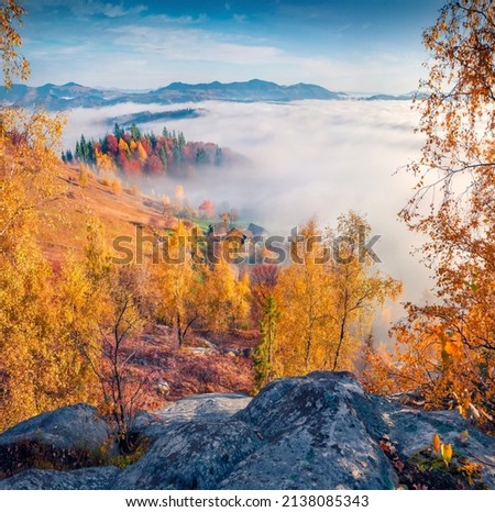 Exciting autumn view of mountain village. Foggy morning scene of Carpathian mountains, Sokilsky ridge, Ukraine, Europe. Traveling concept background.
