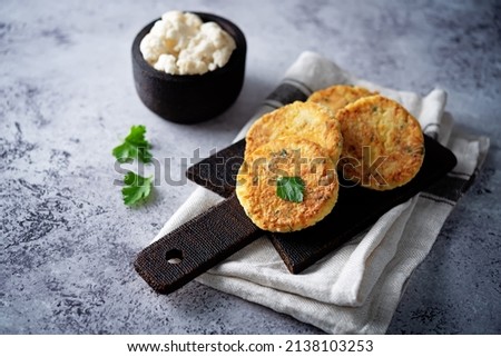 Cauliflower burgers with carrot and parsley. toning. selective focus Royalty-Free Stock Photo #2138103253