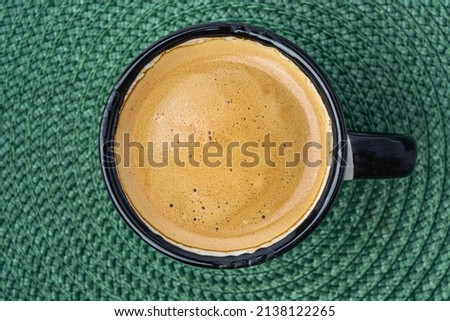 coffee espresso on a green background top view