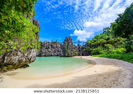 Hidden beach in Matinloc Island, El Nido, Palawan, Philippines - Tour C route - Paradise lagoon and beach in tropical scenery Royalty-Free Stock Photo #2138125851