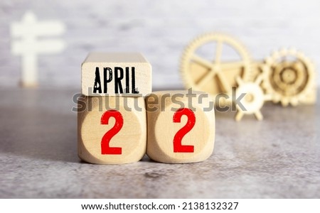 April 22nd. Earth Day. Image of april 22 wooden color calendar on white background. Spring day, empty space for text Royalty-Free Stock Photo #2138132327
