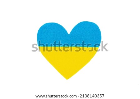 Heart in the colors of the Ukrainian flag. Stop the war concept. Felt heart isolated on white background. Flat lay, a place for text, mockup, template, top view