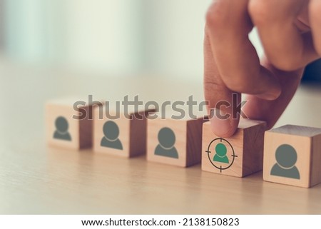 Target customer, buyer persona, marketing segmentation, job recruitment concept. Personalization marketing, customer centric strategies. Putting wooden cubes with focused on target customer symbols. Royalty-Free Stock Photo #2138150823