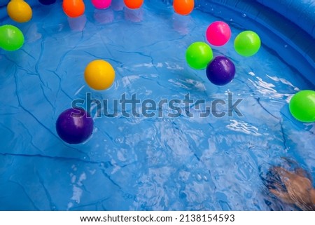 Colorful balls on portable swimming pool