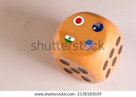 japan,australia,usa and india  countries flags paint over on wooden dice.Quad plus countries.  Royalty-Free Stock Photo #2138183039