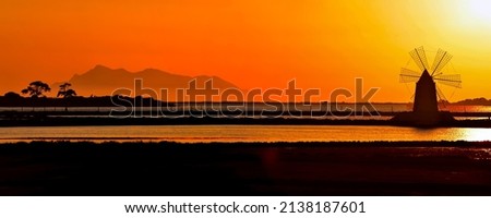 Panorama of the dawn over the mill by the river. Sunrise over windmill farm panoramic landscape. Mill at dawn panorama. Sunrise mill panorama Royalty-Free Stock Photo #2138187601
