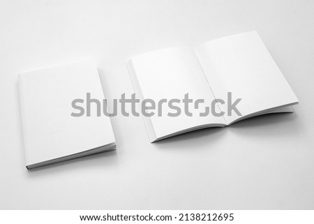 Mockup of brochure with fold. Blank mock up of booklet, menu and book. White paper of magazine. Mockup of leaflet. Template of twofold pamphlet isolated on white background Royalty-Free Stock Photo #2138212695