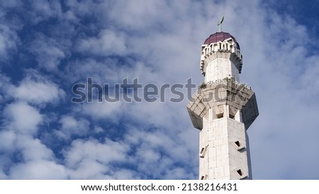 Mosque tower with blue sky background and copy space for text 