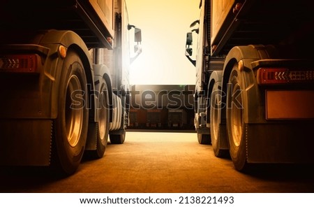 Semi Trailer Trucks on Parking at Distribution Warehouse with The Sunset. Truck Wheels Tires. Auto Service Shop. Shipping Trucks. Lorry Tractor. Industry Freight Trucks Logistics Cargo Transport.	
 Royalty-Free Stock Photo #2138221493
