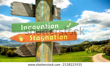 Street Sign the Direction Way to Innovation versus Stagnation Royalty-Free Stock Photo #2138221935