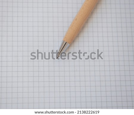 White blank paper with a pen to write
