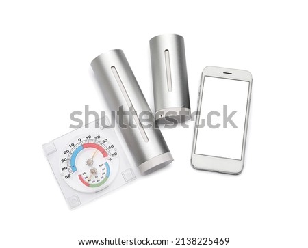 Weather forecast equipment and mobile phone on white background