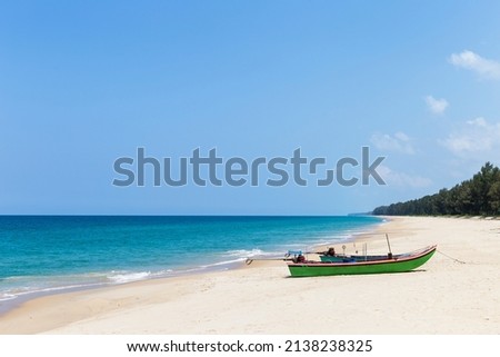 Wooden fishing boat on beautiful beach in south of Thailand, tropical island, summer holiday destination in Asia