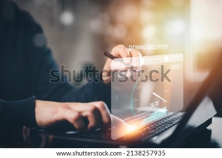 Fast internet connection with Metaverse technology concept, Hand holding smartphone and Virtual screen of Internet speed measurement,Internet and technology concept, 5G Hi speed internet concept Royalty-Free Stock Photo #2138257935